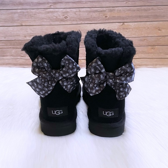 UGG Women’s Mini Bailey Bow Leopard Black Boots - Picture 2 of 9